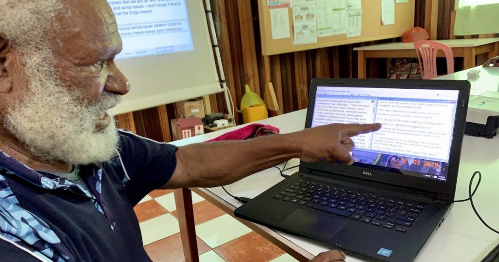 Rev. Maniosa explaining his translation program.